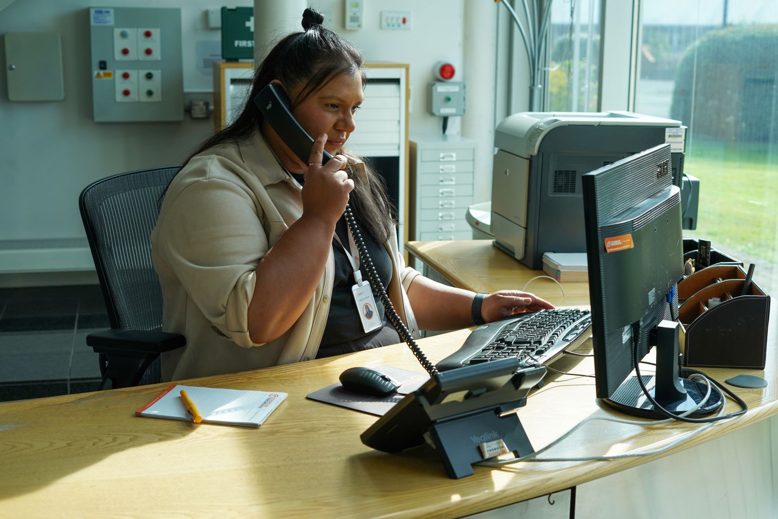 receptionist on a phone call